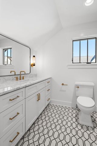 a view of house with backyard outdoor seating and plants