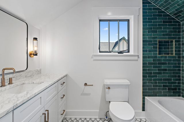 a front view of a house with garage