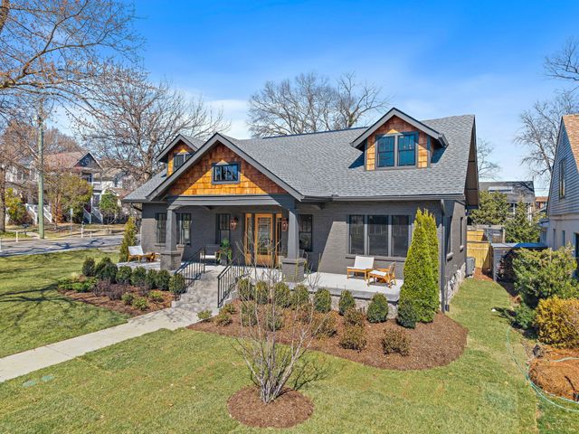 a living room with furniture and a walk in closet