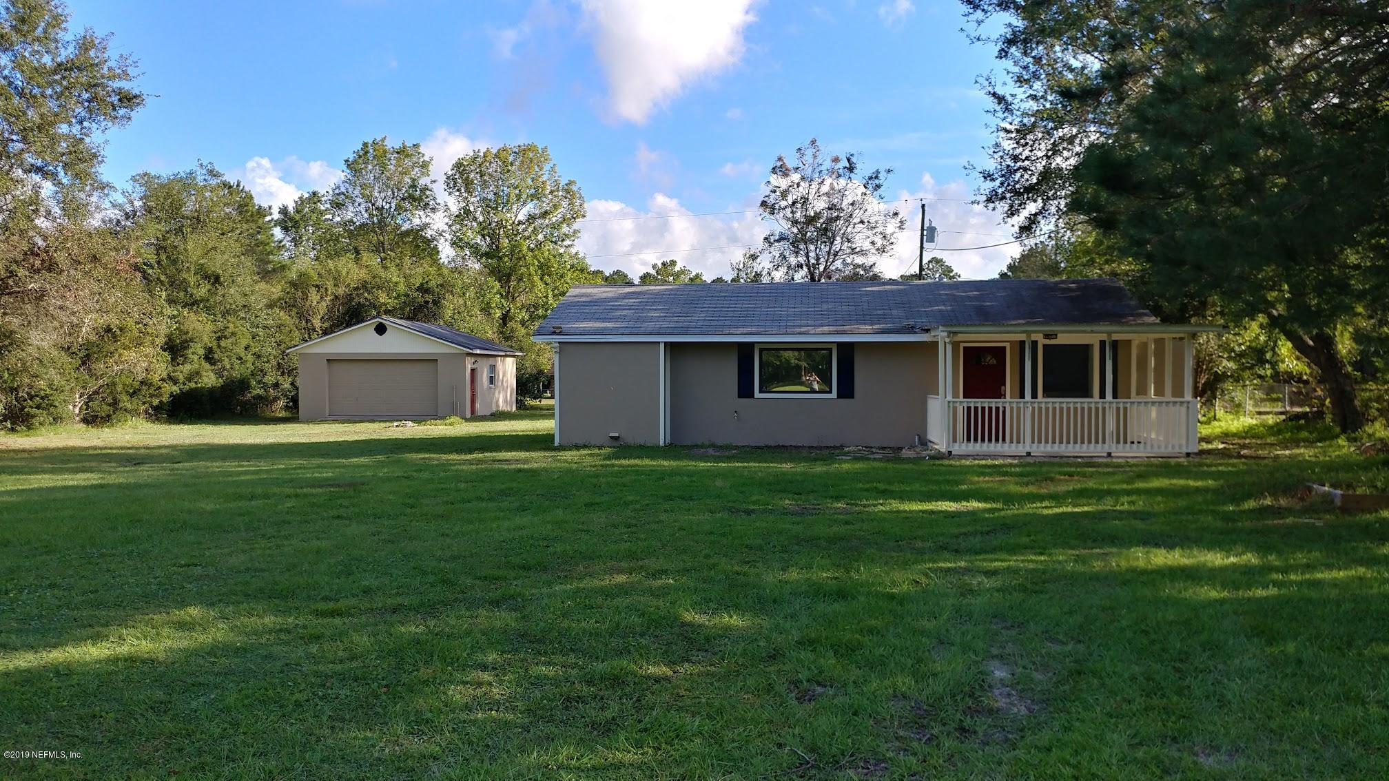 54102 Snyder Road Callahan, FL 32011 - Photo 1 of 14 a front view of house with yard and green space