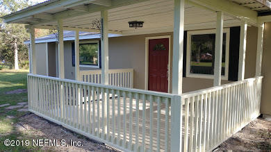54102 Snyder Road Callahan, FL 32011 - Photo 2 of 14 a view of a porch with a small cabin