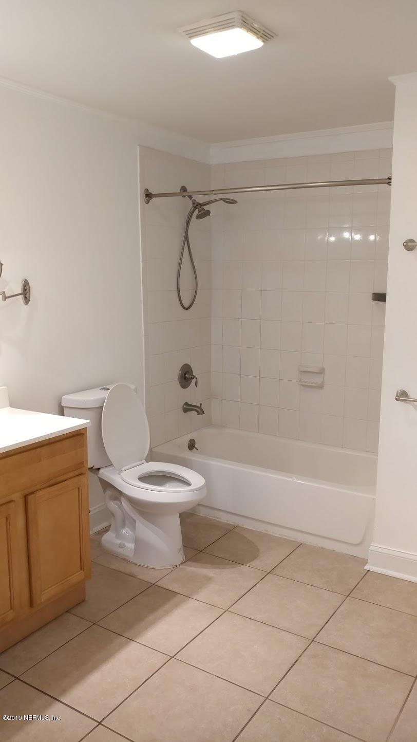 54102 Snyder Road Callahan, FL 32011 - Photo 10 of 14 a bathroom with a toilet a sink and a shower