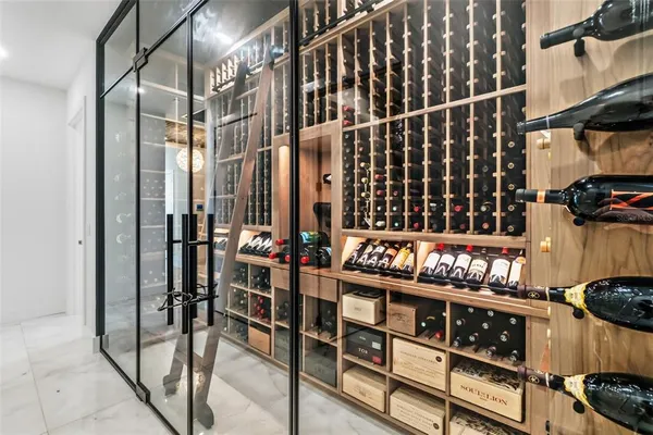 a living room with furniture a table and large windows