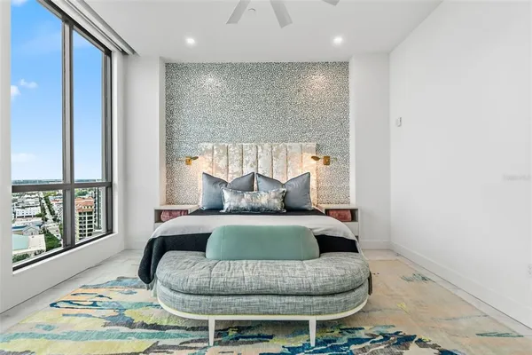 a roof deck with a table and chairs