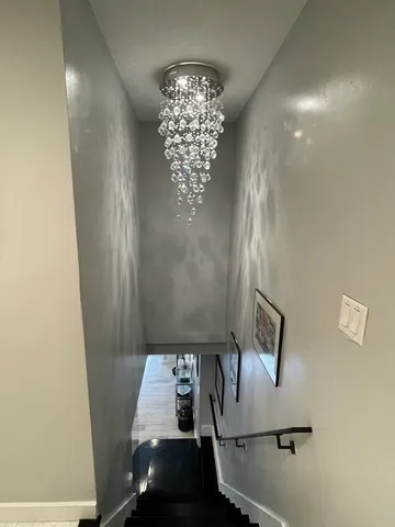 a spacious bedroom with a bed and a couch