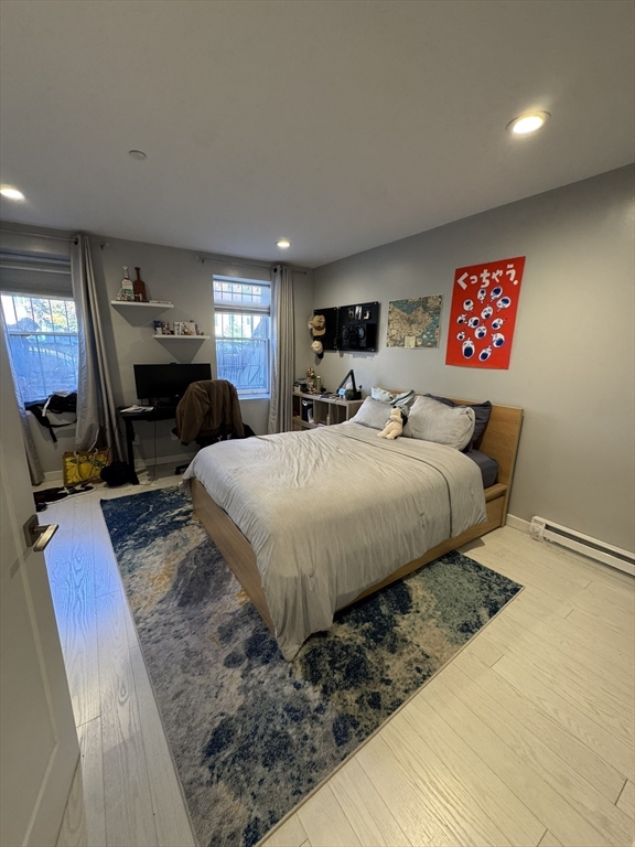 469 Massachusetts Avenue, Unit 1 Boston, MA 02118 - Photo 12 of 33 a bedroom with bed and window
