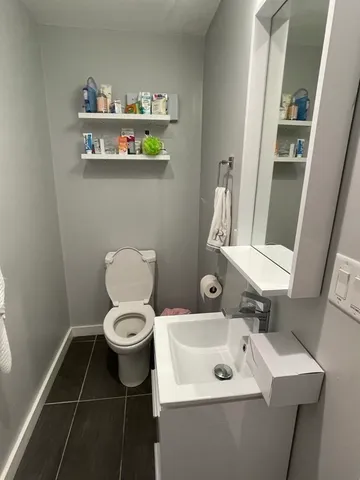 a bedroom with bed and a window