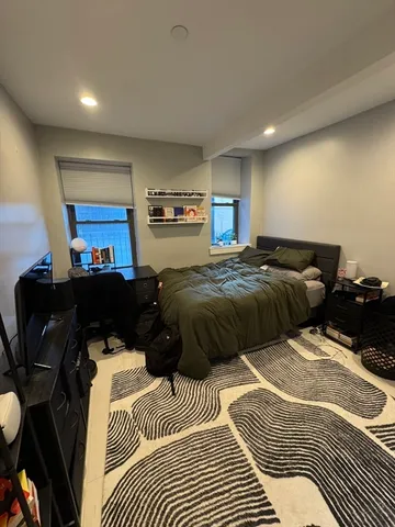 a bedroom with a bed and furniture