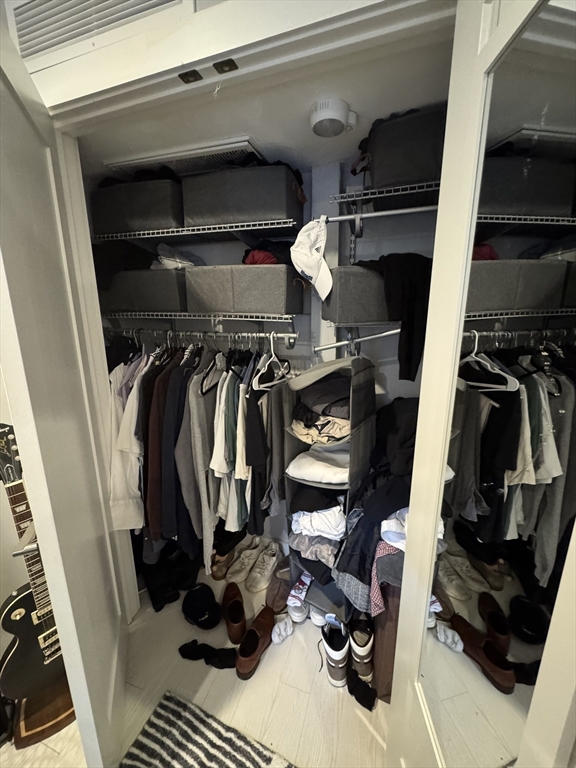 469 Massachusetts Avenue, Unit 1 Boston, MA 02118 - Photo 21 of 33 a view of walk in closet with clothes and shoes
