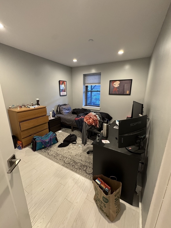 469 Massachusetts Avenue, Unit 1 Boston, MA 02118 - Photo 22 of 33 a bedroom with bed and a window