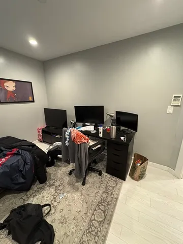 a large kitchen with stainless steel appliances granite countertop a stove a sink and a refrigerator