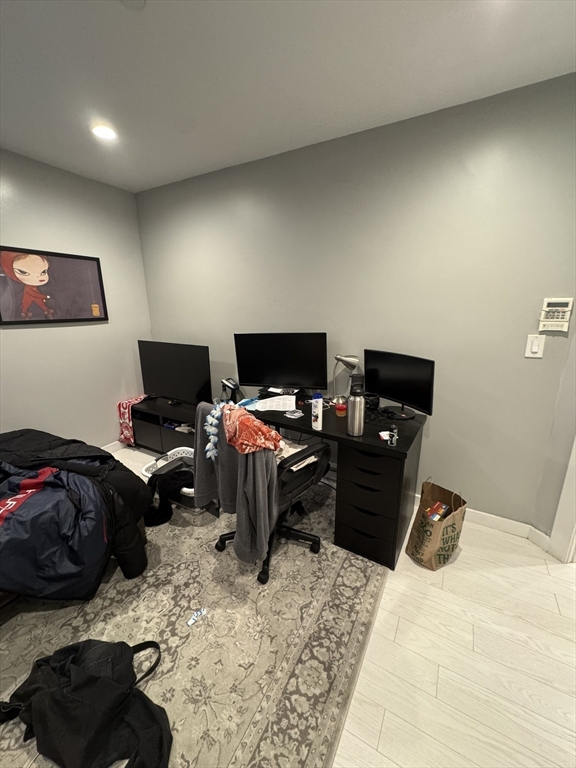 469 Massachusetts Avenue, Unit 1 Boston, MA 02118 - Photo 23 of 33 a bedroom with a bed and furniture