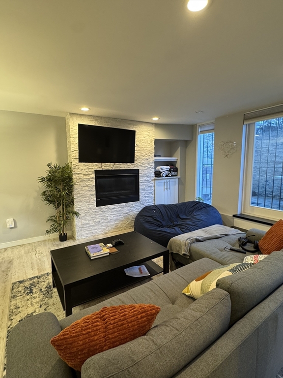 469 Massachusetts Avenue, Unit 1 Boston, MA 02118 - Photo 5 of 33 a living room with furniture and a flat screen tv