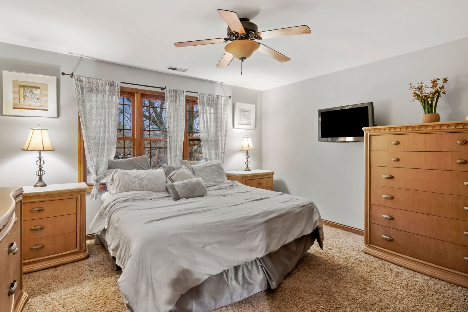 181 Herrick Road Riverside, IL 60546 - Photo 20 of 27 a bedroom with a bed and a flat screen tv