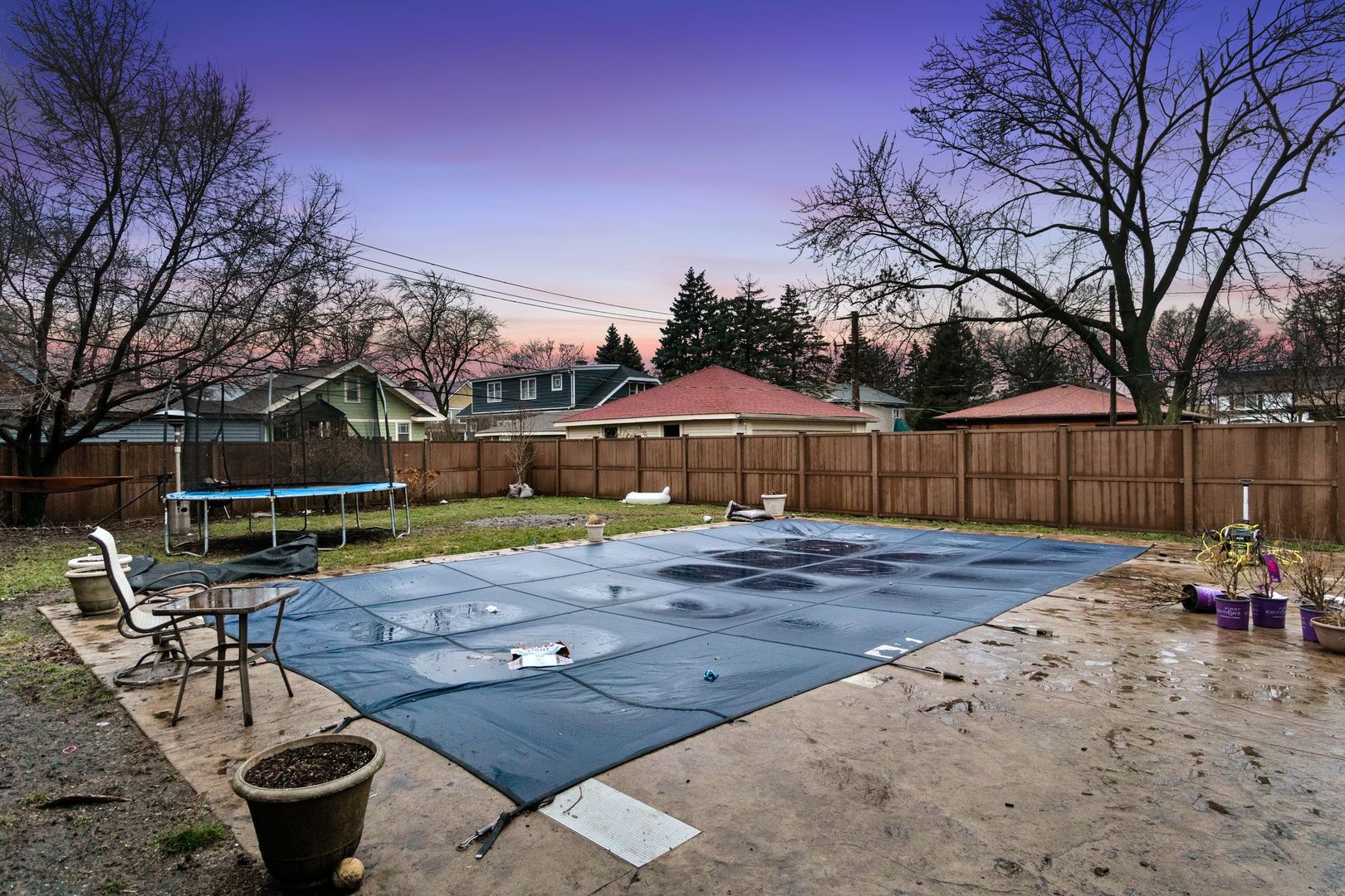 181 Herrick Road Riverside, IL 60546 - Photo 27 of 27 a view of a backyard with table and chairs under an umbrella