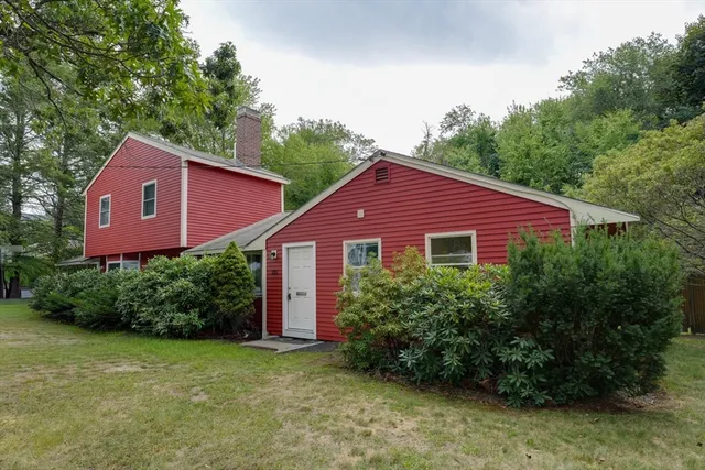 a view of a house with a yard and plants