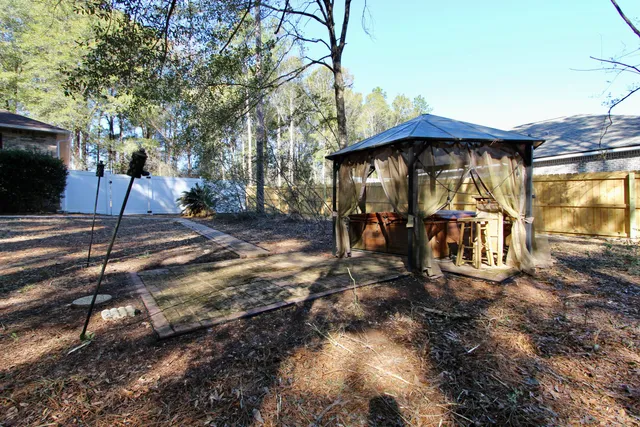 a view of a bathroom with a sink and mirror