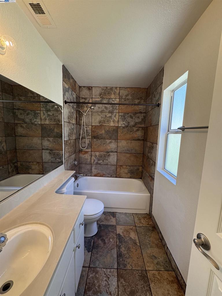 8145 Mountain View Drive Pleasanton, CA 94588 - Photo 17 of 19 a bathroom with a sink toilet and shower