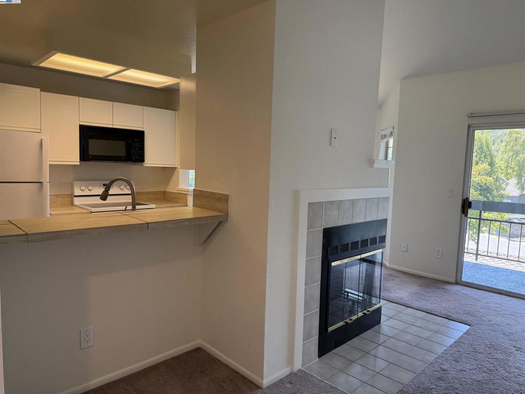 8145 Mountain View Drive Pleasanton, CA 94588 - Photo 2 of 19 a living room with furniture and a fireplace