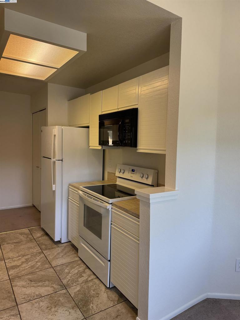 8145 Mountain View Drive Pleasanton, CA 94588 - Photo 5 of 19 a kitchen with a stove and a refrigerator