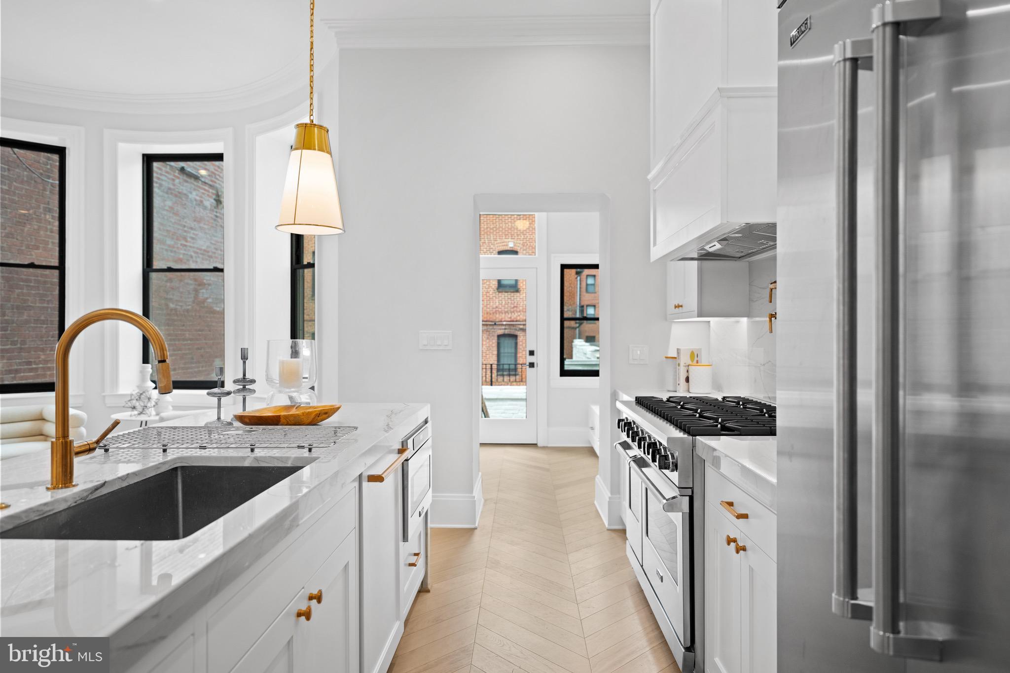 1834 16th Street Northwest Washington, DC 20009 - Photo 8 of 52 Monogram appliances, specialty quartzite surfaces