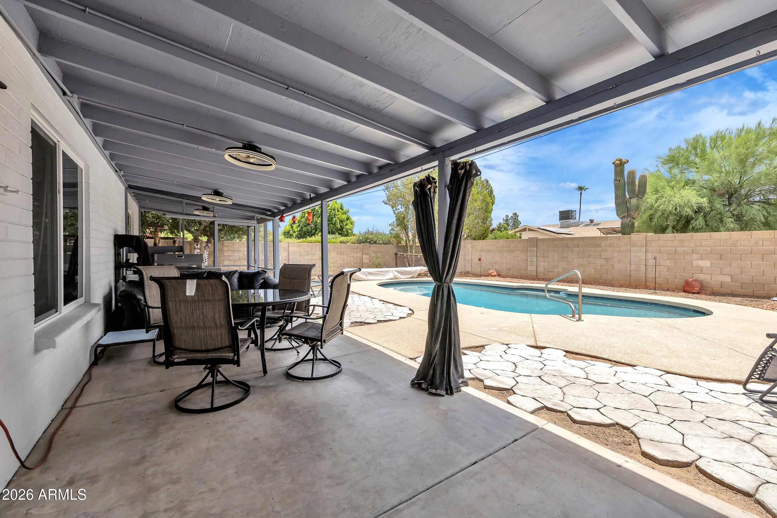 3833 West Phelps Road Phoenix, AZ 85053 - Photo 46 of 55 Lengthy patio with screened in porch