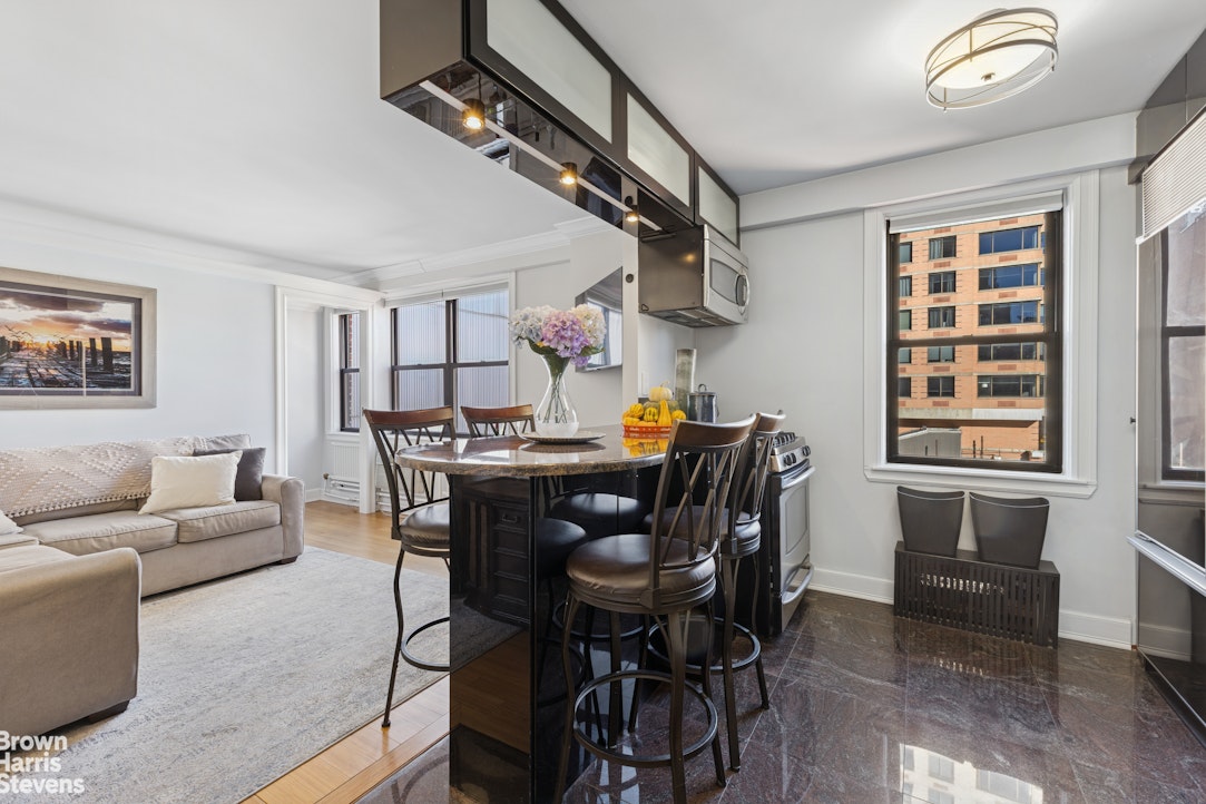 330 3rd Avenue, Unit 10B Manhattan, NY 10010 - Photo 5 of 14 a view of a livingroom with furniture and a window