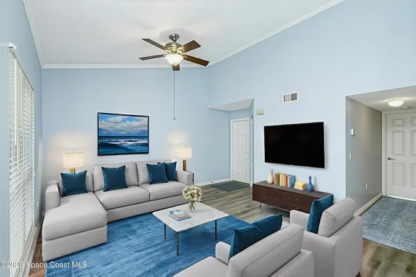 a living room with furniture and a flat screen tv