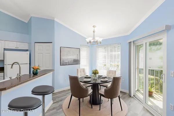 a dining room with furniture and window