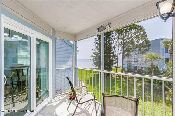 a view of a chair and table in a balcony