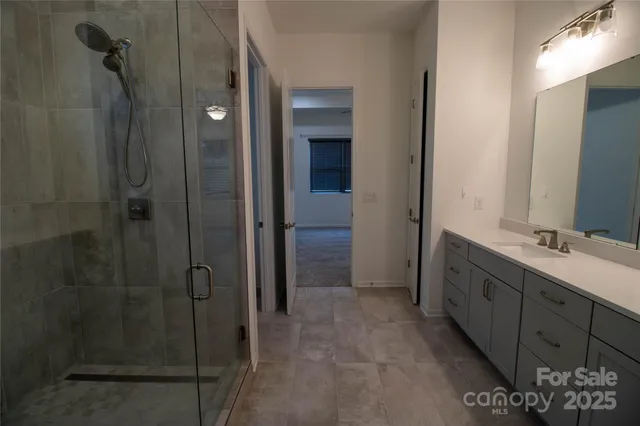 a bathroom with a double vanity sink and mirror