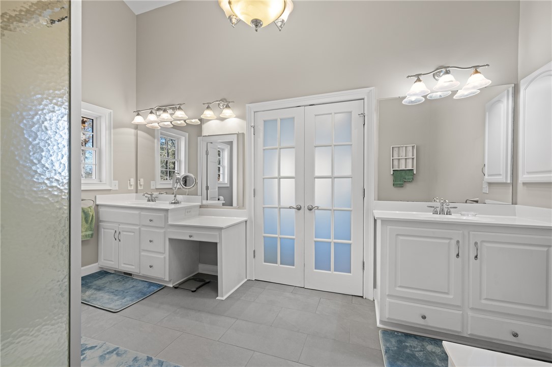 204 Riverlake Road Fair Play, SC 29643 - Photo 19 of 50 This spacious bathroom offers dual vanities and elegant tile flooring for comfort and style.