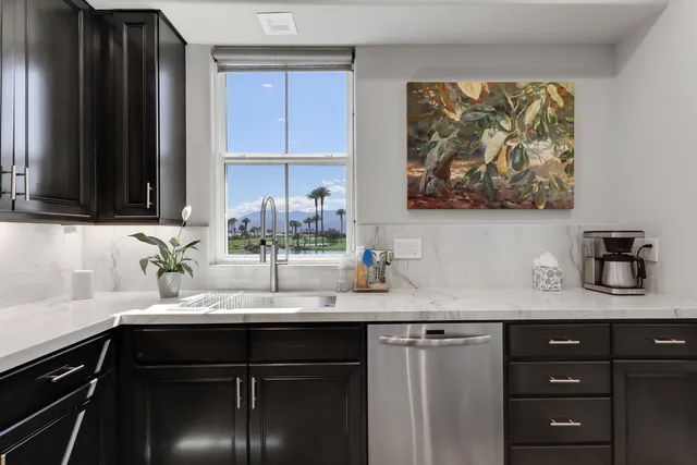 a kitchen with a sink and cabinets