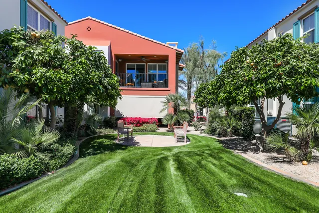 a front view of house with yard and trees
