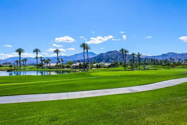a view of a golf course with a lake