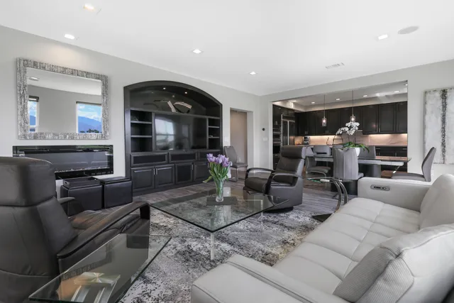 a living room with furniture and flat screen tv