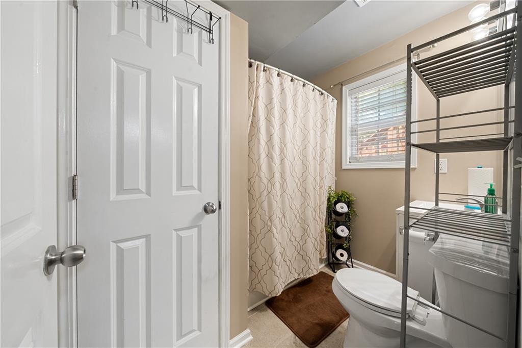 55 Meridian Point Dallas, GA 30132 - Photo 30 of 45 a bathroom with a shower curtain