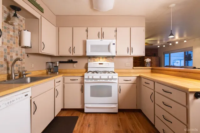 a dining room with a fireplace and a floor to ceiling window