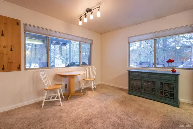 a bathroom with a granite countertop sink and a bathtub