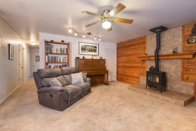 a kitchen with a sink cabinets and wooden floor