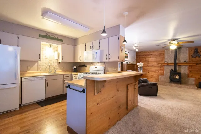 a bathroom with a tub sink shower and mirror
