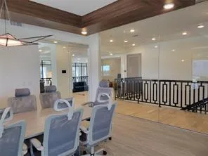 a dining room with furniture and a chandelier