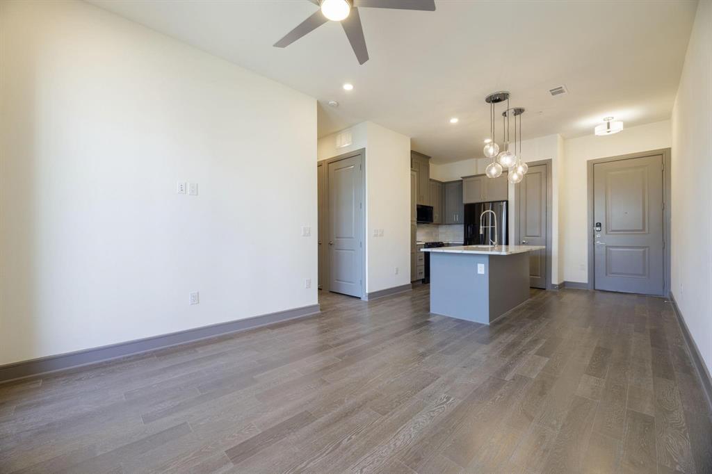 2700 Old Denton Road, Unit 3362 Carrollton, TX 75007 - Photo 4 of 18 a view of kitchen with wooden floor