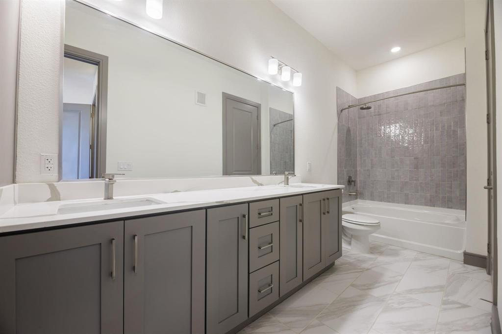 2700 Old Denton Road, Unit 3362 Carrollton, TX 75007 - Photo 6 of 18 a bathroom with double sink and a mirror