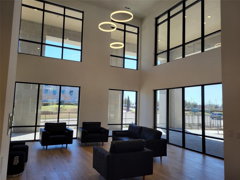 2700 Old Denton Road, Unit 3362 Carrollton, TX 75007 - Photo 9 of 18 a living room with furniture and a large window
