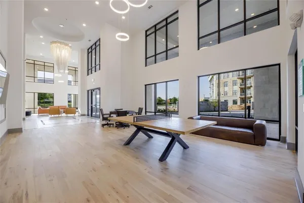 a living room with patio furniture and a table