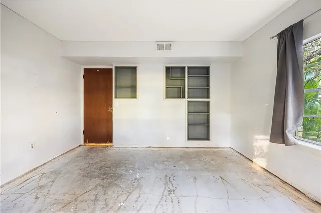 an empty room with windows