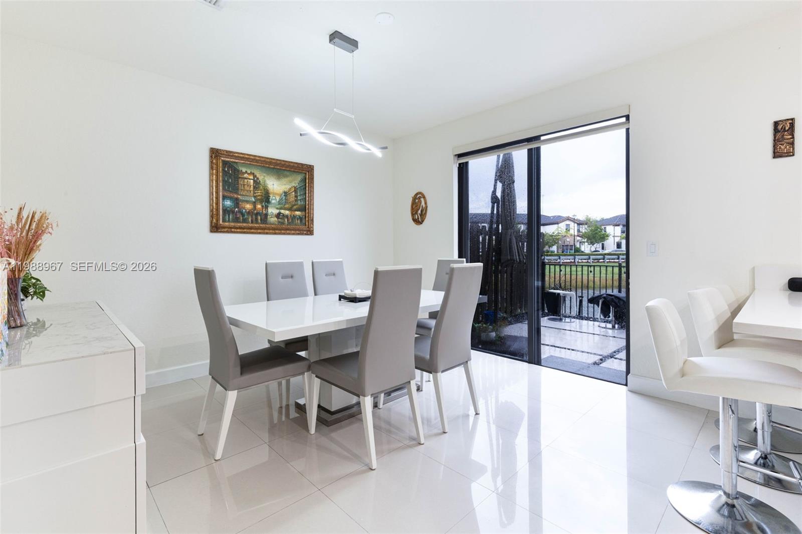 9015 Northwest 183rd Street Hialeah, FL 33018 - Photo 13 of 45 a view of a dining room with furniture window and outside view