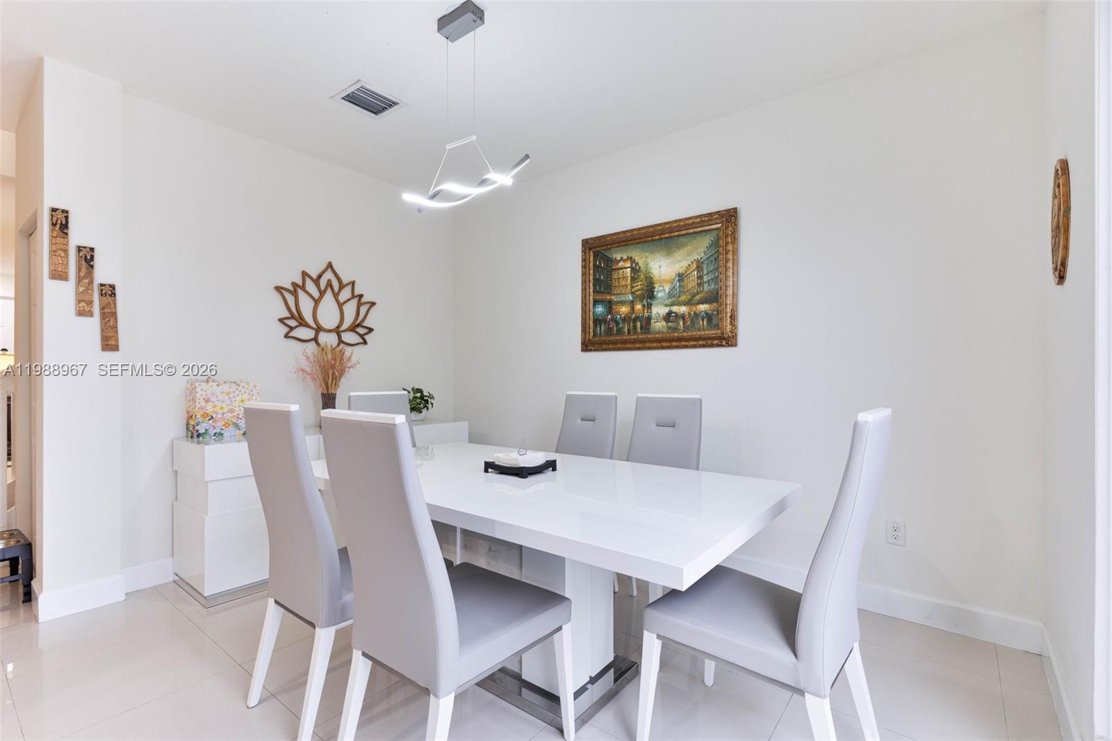 9015 Northwest 183rd Street Hialeah, FL 33018 - Photo 14 of 45 a view of a dining room with furniture