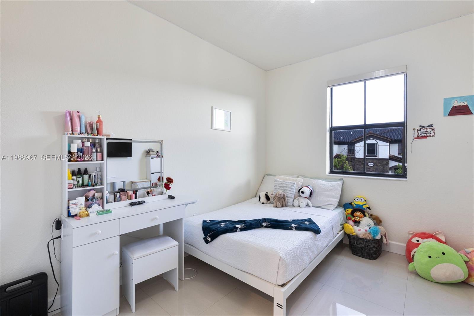 9015 Northwest 183rd Street Hialeah, FL 33018 - Photo 23 of 45 a bedroom with furniture and a window